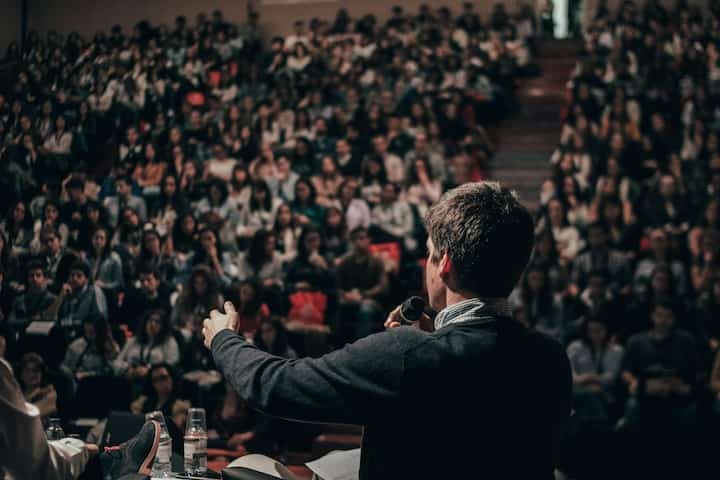 man-speaking-in-front-of-crowd-public-speaking
