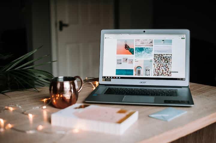 turned-on-acer-laptop-on-table-near-cup-blog