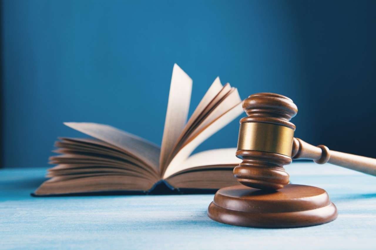 judges-gavel-and-open-book-on-table-law
